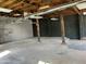 Spacious basement ready for customization with concrete floors, exposed ceiling, and natural light at 206 S 5Th St, Buckeye, AZ 85326