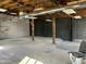 Large unfinished basement with concrete floors, exposed ceiling, perfect for storage or renovation at 206 S 5Th St, Buckeye, AZ 85326