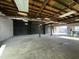 Spacious garage with high ceilings and exposed beams at 206 S 5Th St, Buckeye, AZ 85326