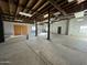 Spacious garage with high ceilings and exposed beams at 206 S 5Th St, Buckeye, AZ 85326