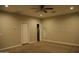 Spacious bedroom featuring neutral paint, carpeted floor, ceiling fan and a closet at 2215 W Highland Ave, Phoenix, AZ 85015