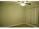 Bedroom featuring neutral walls, ceiling fan, and a window with privacy shade at 2215 W Highland Ave, Phoenix, AZ 85015