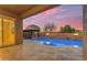 Inviting backyard features a sparkling pool, fire bowls, built-in barbecue, and a covered patio at 22186 E Via Del Verde --, Queen Creek, AZ 85142
