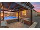 The patio area showcases a built-in grill, pool, fire bowls and steps leading up to the house at 22186 E Via Del Verde --, Queen Creek, AZ 85142