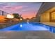 The backyard features a sparkling pool, patio and elegant fire bowls at 22186 E Via Del Verde --, Queen Creek, AZ 85142