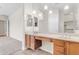 Bathroom with a dual sink vanity and view to walk-in closet at 22186 E Via Del Verde --, Queen Creek, AZ 85142