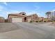 Spacious home featuring a three-car garage, desert landscaping, and well-maintained exterior at 22186 E Via Del Verde --, Queen Creek, AZ 85142