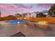 Stunning backyard pool with travertine deck, fire bowls, fire pit and outdoor living space for entertaining at 22186 E Via Del Verde --, Queen Creek, AZ 85142