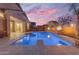Backyard pool with diving board and relaxing fire bowls, surrounded by a spacious travertine patio at 22186 E Via Del Verde --, Queen Creek, AZ 85142
