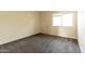 Cozy bedroom with gray carpet and window at 2221 W Farmdale Ave # 7, Mesa, AZ 85202