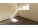 Sun-filled bedroom with carpet and a view from the window at 2221 W Farmdale Ave # 7, Mesa, AZ 85202