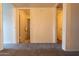 Spacious bedroom with carpet and two doorways to bathroom and hallway at 2221 W Farmdale Ave # 7, Mesa, AZ 85202