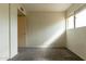 Bright bedroom with gray carpet and natural light from the window at 2221 W Farmdale Ave # 7, Mesa, AZ 85202