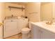 Bright laundry room featuring a washer, dryer, sink and vanity at 2221 W Farmdale Ave # 7, Mesa, AZ 85202