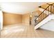 Tile-floored living room, bright with natural light, staircase, and view to bathroom and hall at 2221 W Farmdale Ave # 7, Mesa, AZ 85202