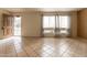 Bright living room with tile flooring, natural light from windows, and an open entryway at 2221 W Farmdale Ave # 7, Mesa, AZ 85202
