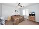 Cozy bedroom with neutral carpet and a ceiling fan, offering a comfortable space at 24113 N 26Th Pl, Phoenix, AZ 85024