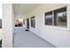 Long, covered patio with exterior lighting and plenty of space for entertaining at 24113 N 26Th Pl, Phoenix, AZ 85024