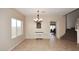Open-concept dining room featuring neutral walls, tile floors and natural lighting at 24113 N 26Th Pl, Phoenix, AZ 85024