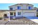 Charming two-story home featuring a well-maintained front yard and attached two-car garage at 24113 N 26Th Pl, Phoenix, AZ 85024