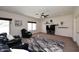 Living room featuring plush seating, ceiling fan, and modern decor at 24113 N 26Th Pl, Phoenix, AZ 85024