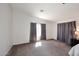 Large main bedroom with a ceiling fan, carpeted floors, and curtains at 24113 N 26Th Pl, Phoenix, AZ 85024