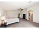 Spacious main bedroom with carpet, ceiling fan, archway to a walk-in closet and neutral walls at 24113 N 26Th Pl, Phoenix, AZ 85024