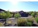 Scenic view of a neighborhood featuring homes with desert landscaping and pathways on a bright, sunny day at 24113 N 26Th Pl, Phoenix, AZ 85024