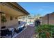 Spacious backyard featuring a covered patio with outdoor seating, a built-in BBQ, and a private pool at 2414 W White Feather Ln, Phoenix, AZ 85085