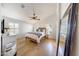 Serene bedroom featuring wood floors, natural light, and a ceiling fan at 2414 W White Feather Ln, Phoenix, AZ 85085