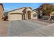 Charming single-story home with neutral stucco, desert landscaping and a spacious two car garage at 2414 W White Feather Ln, Phoenix, AZ 85085