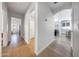 Hallway featuring wood floors and arches, providing access to other areas of the home at 2414 W White Feather Ln, Phoenix, AZ 85085