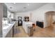 Open-concept kitchen featuring light-colored cabinets, a large island, and stainless-steel appliances at 2414 W White Feather Ln, Phoenix, AZ 85085