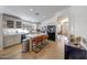 Open-concept kitchen featuring light-colored cabinets, a large island, and stainless-steel appliances at 2414 W White Feather Ln, Phoenix, AZ 85085