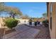 Relaxing backyard with a private pool, desert landscaping, and comfortable lounge chairs at 2414 W White Feather Ln, Phoenix, AZ 85085