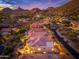 Aerial view of a home with mountain views, private pool, and desert landscaping at 24350 N Whispering Ridge Way # 22, Scottsdale, AZ 85255