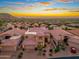 Aerial view of the house showcasing the tile roof, desert landscaping, and sprawling neighborhood at 24350 N Whispering Ridge Way # 22, Scottsdale, AZ 85255