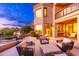 Beautiful outdoor living space with comfortable seating, lush landscaping, and peaceful views at twilight at 24350 N Whispering Ridge Way # 22, Scottsdale, AZ 85255