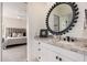 Bathroom featuring a vanity with granite countertops, a decorative mirror, and neutral tones at 24350 N Whispering Ridge Way # 22, Scottsdale, AZ 85255