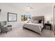 Bedroom featuring a queen bed, accent chair, and views of the surrounding landscape at 24350 N Whispering Ridge Way # 22, Scottsdale, AZ 85255
