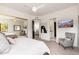 Bedroom showcasing a large closet, ensuite bathroom, and a view of the television at 24350 N Whispering Ridge Way # 22, Scottsdale, AZ 85255