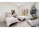 Bedroom with two twin beds, white walls, and a large window showcasing the outdoor views at 24350 N Whispering Ridge Way # 22, Scottsdale, AZ 85255