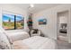 Bedroom featuring two twin beds, an accent chair, and a view of the surrounding desert at 24350 N Whispering Ridge Way # 22, Scottsdale, AZ 85255