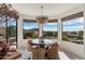 Cozy dining area with stylish chairs and expansive mountain views through large windows at 24350 N Whispering Ridge Way # 22, Scottsdale, AZ 85255