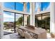 Bright dining room with large windows offering views of lush greenery and scenic valley at 24350 N Whispering Ridge Way # 22, Scottsdale, AZ 85255