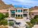 Expansive home featuring outdoor seating, dual fountains, and mountain views at 24350 N Whispering Ridge Way # 22, Scottsdale, AZ 85255