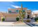 Modern two-story home featuring mature saguaro cactus, desert landscaping and three car garage at 24350 N Whispering Ridge Way # 22, Scottsdale, AZ 85255