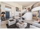Elegant foyer with modern artwork, soaring ceilings, and a gracefully curved staircase at 24350 N Whispering Ridge Way # 22, Scottsdale, AZ 85255