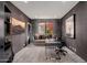 Inviting office space featuring a modern desk, comfortable sofa, and vibrant outdoor views at 24350 N Whispering Ridge Way # 22, Scottsdale, AZ 85255