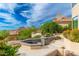 A tiered patio with elegant water feature and mountain views at 24350 N Whispering Ridge Way # 22, Scottsdale, AZ 85255
